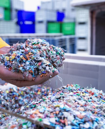 Plastic granules are poured from the hand